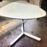 Triangular table with height adjustments
