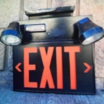 Emergency-EXIT-sign-with-battery-backed-up-lights-in-black-finish
