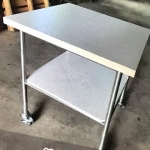 Square dual level table with lockable wheels